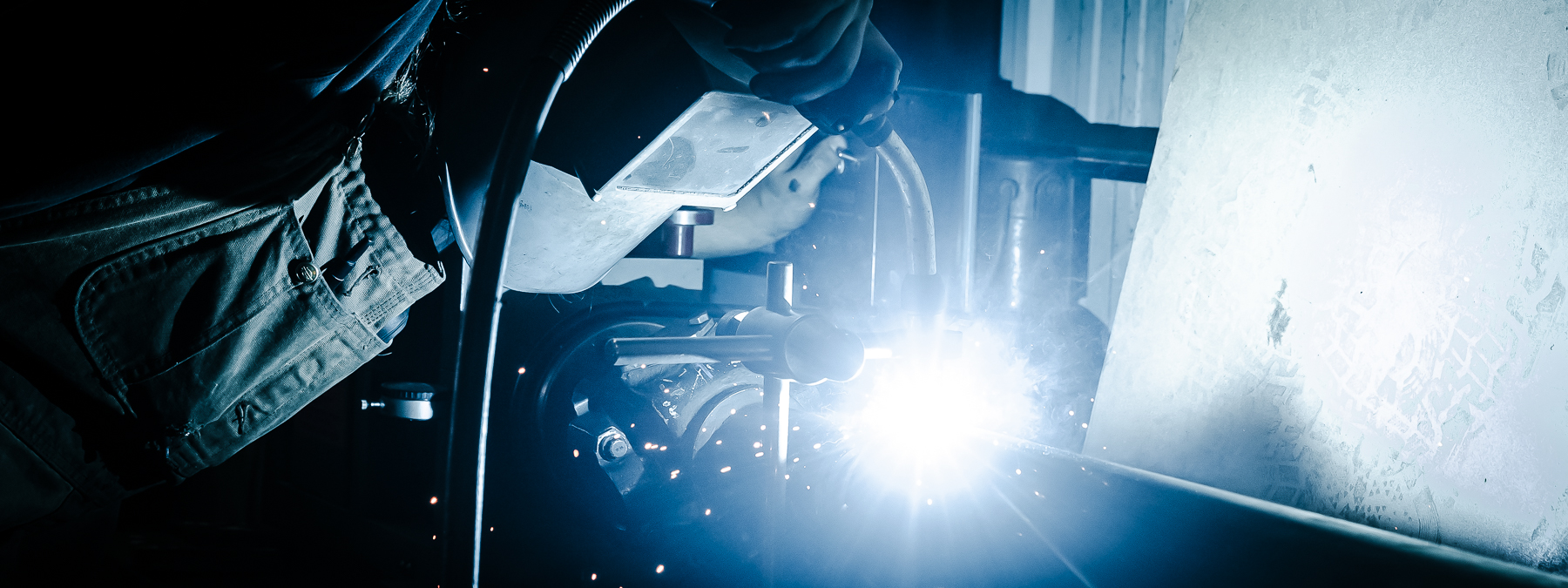 A welder at Five Star industries involved in metal fabrication